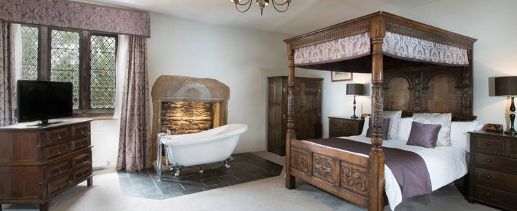 Boringdon Hall four poster room with roll top bath